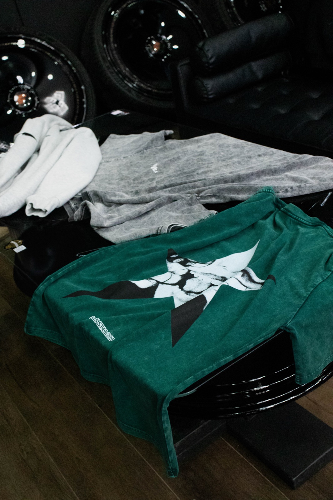 Apparel still life over black wheels